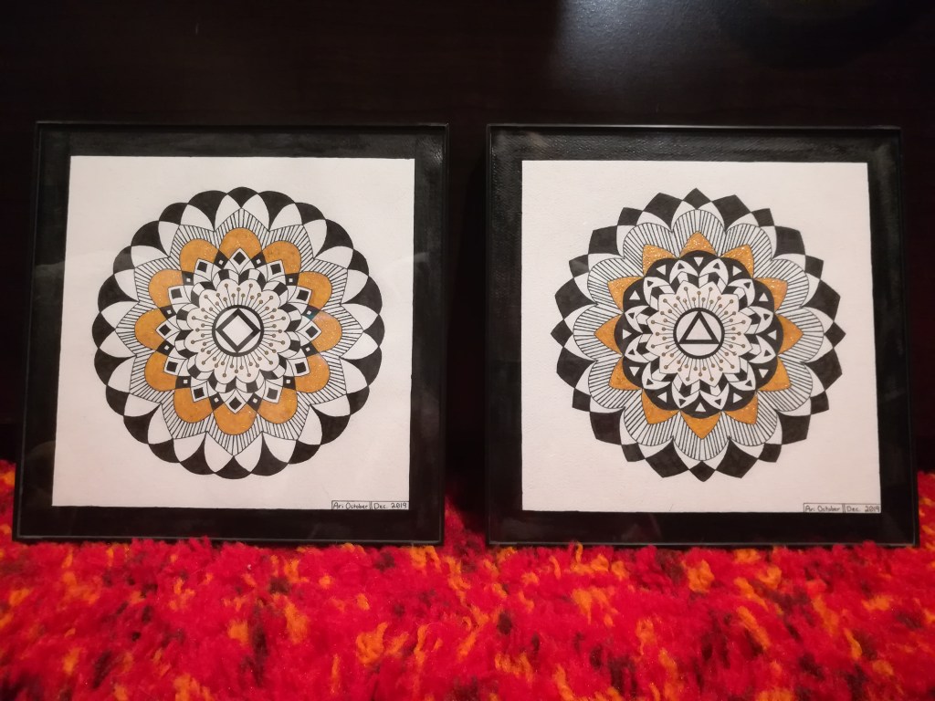 two framed mandalas side by side. 